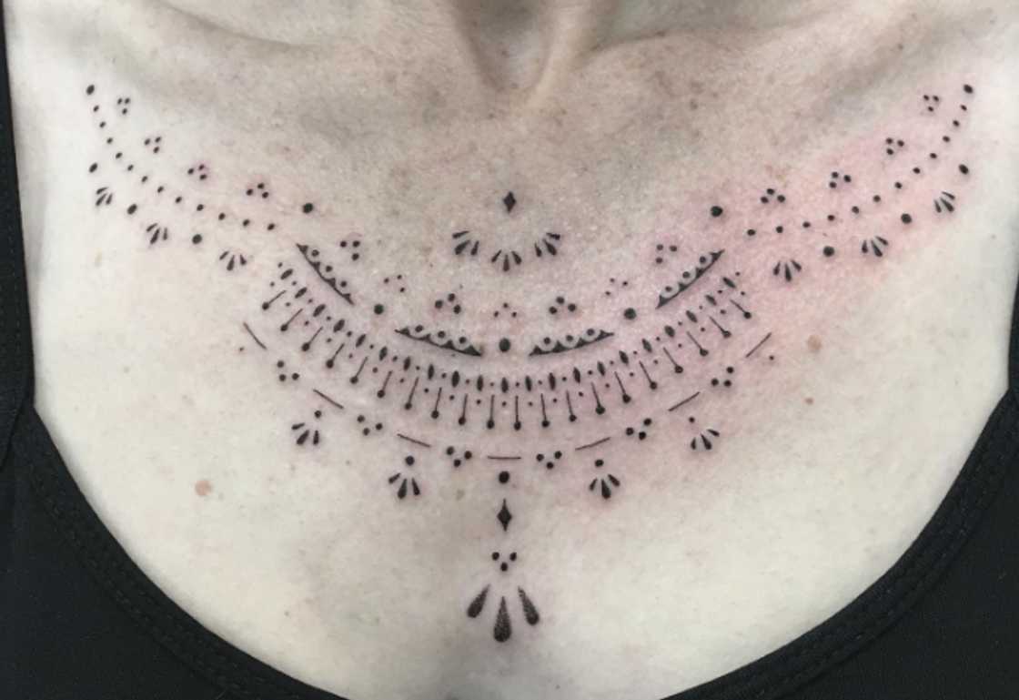Tassel and lace ornamental collarbone tattoo for women Tassel and lace ornamental collarbone tattoo for women
