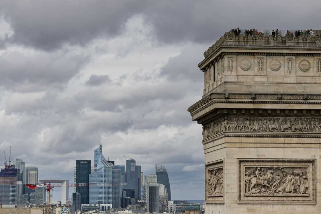 La Defense, the French capital's business district, seen behind the Arc de Triomphe in Paris La Defense, the French capital's business district, seen behind the Arc de Triomphe in Paris