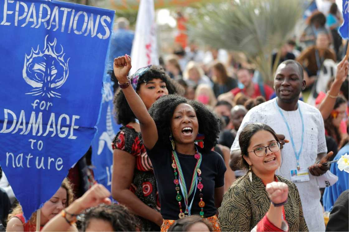 Climate activists protest outside the COP27 in Egypt on November 17, 2022