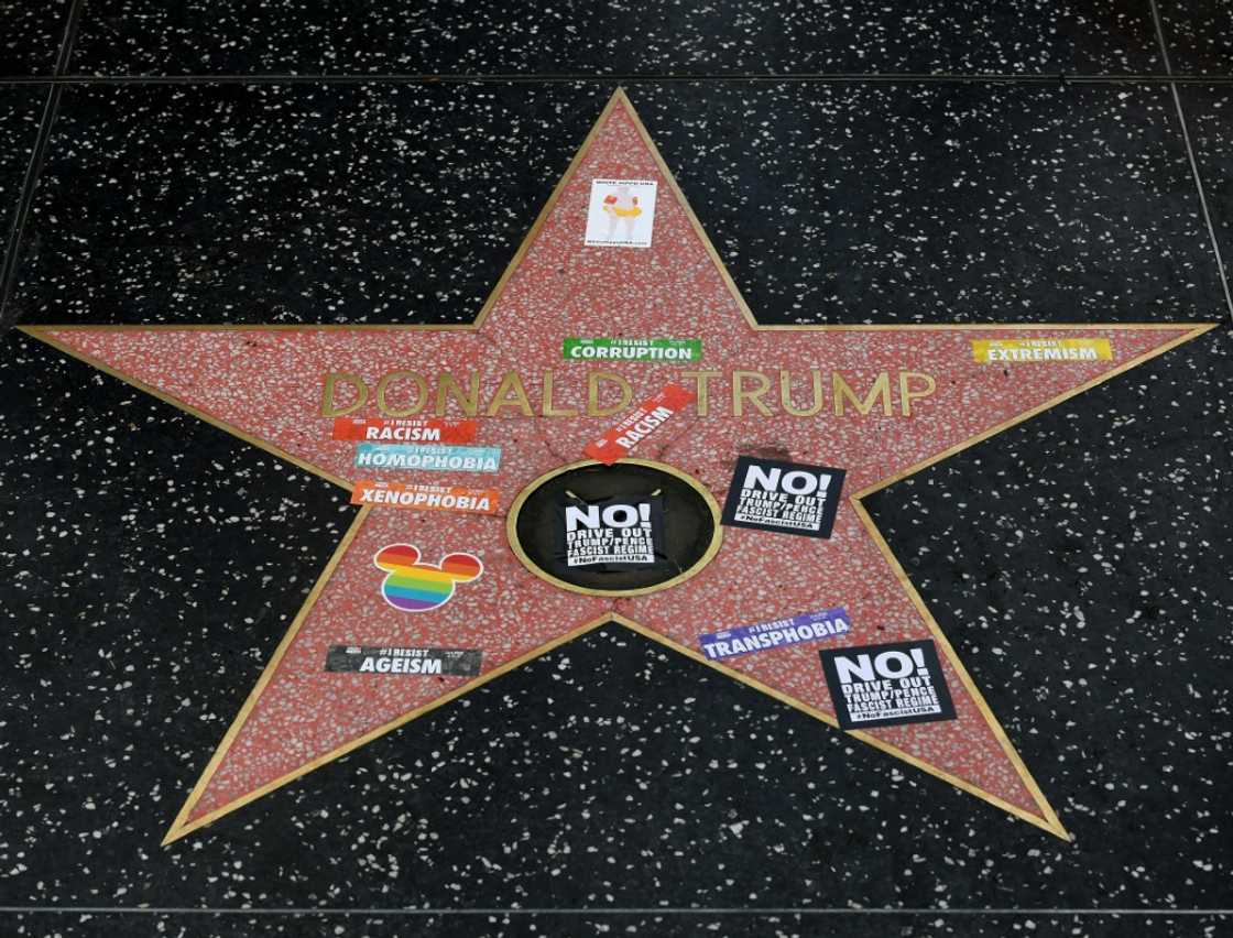 Gay pride stickers are plastered on the Hollywood Walk of Fame Star of Donald Trump in 2017 - reflecting the controversy surrounding his stances against diversity