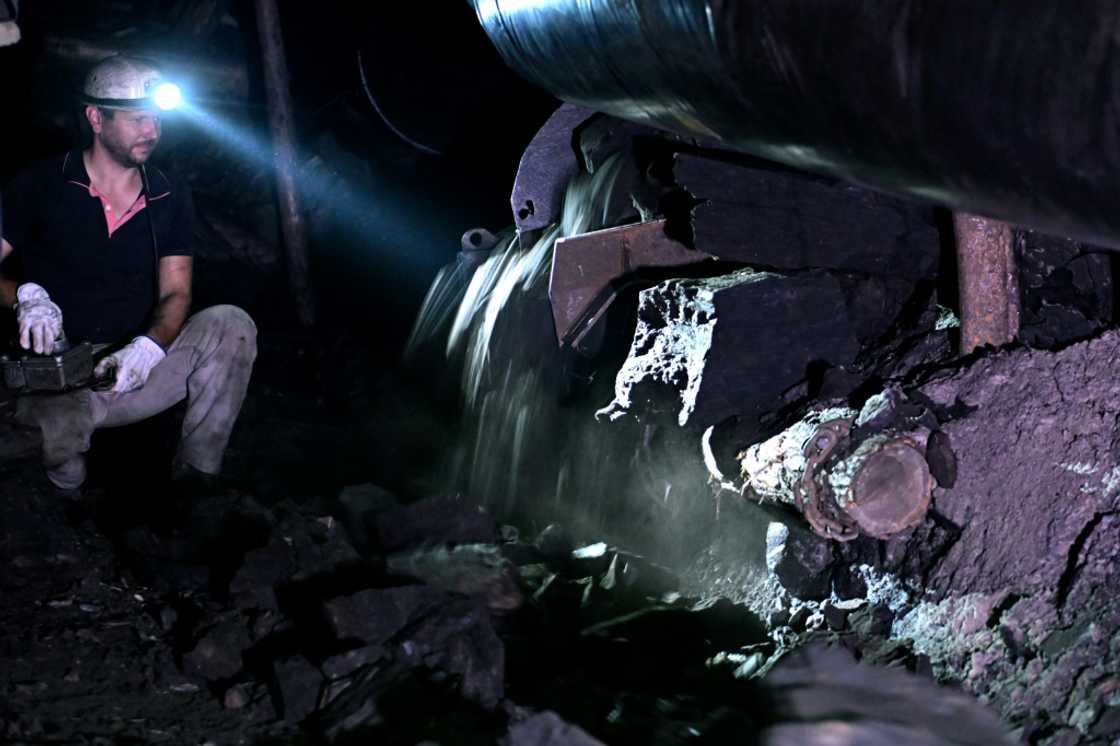 A miner works a 250-metre-deep shaft in the Mramor coal mine near Tuzla