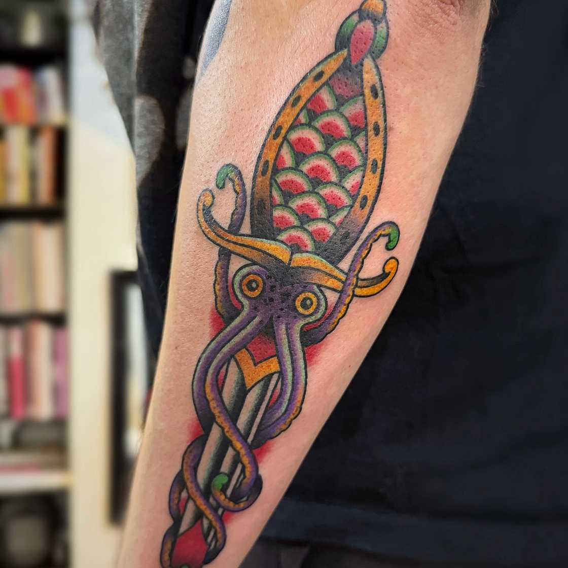 Colourful dagger tattoo Colourful dagger tattoo