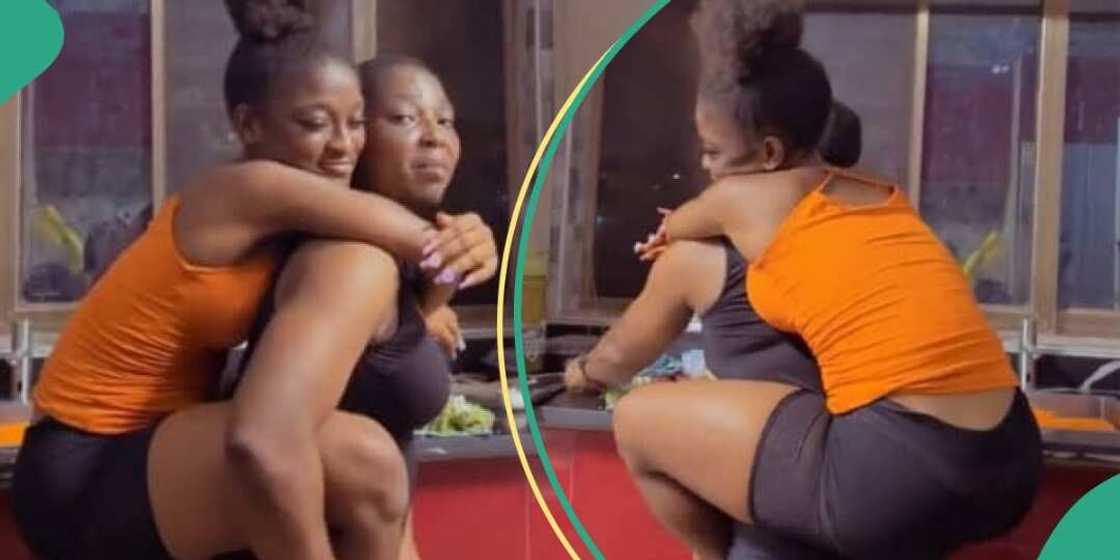 Lady plays with mum in kitchen Lady plays with mum in kitchen