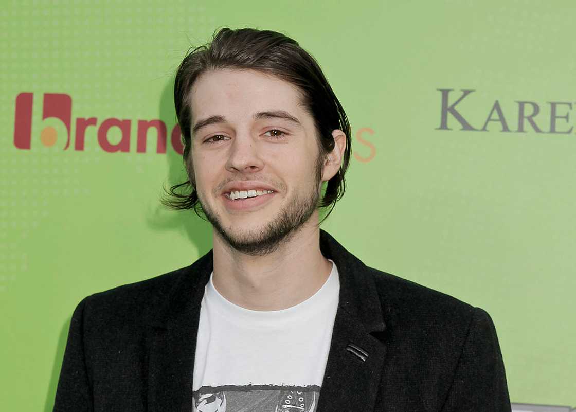 Matt Prokop at a gala red carpet in a white t-shirt and black coat Matt Prokop at a gala red carpet in a white t-shirt and black coat