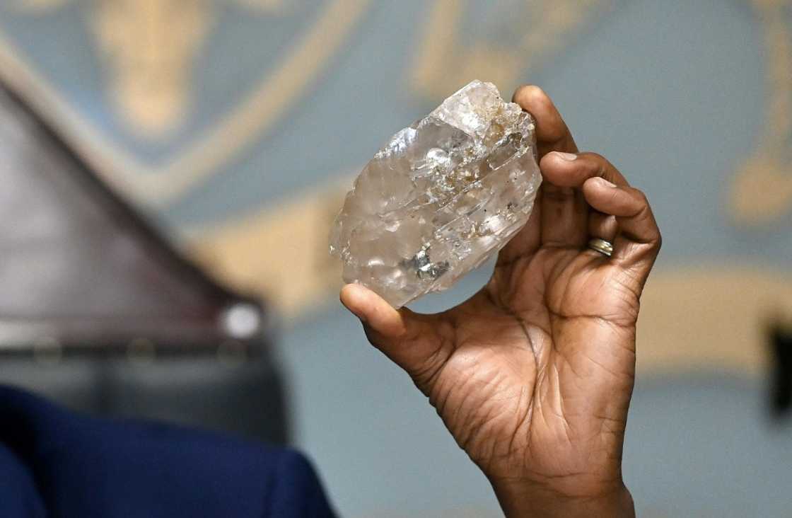 Botswana's President Mokgweetsi Masisi holds a large diamond discovered in Botswana at his office in Gaborone on August 22, 2024 Botswana's President Mokgweetsi Masisi holds a large diamond discovered in Botswana at his office in Gaborone on August 22, 2024