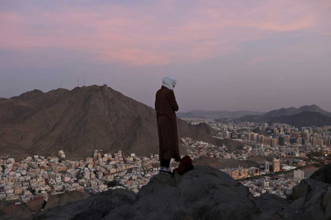 A Muslim pilgrim looks over the holy city of Mecca from atop the Jabal al-Noor or 'Mountain of Light' A Muslim pilgrim looks over the holy city of Mecca from atop the Jabal al-Noor or 'Mountain of Light'