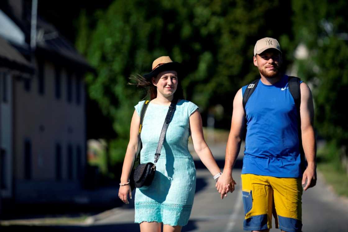 Happy campers: Czech holidaymakers Ales Zidek (right) and Vera Cajkova