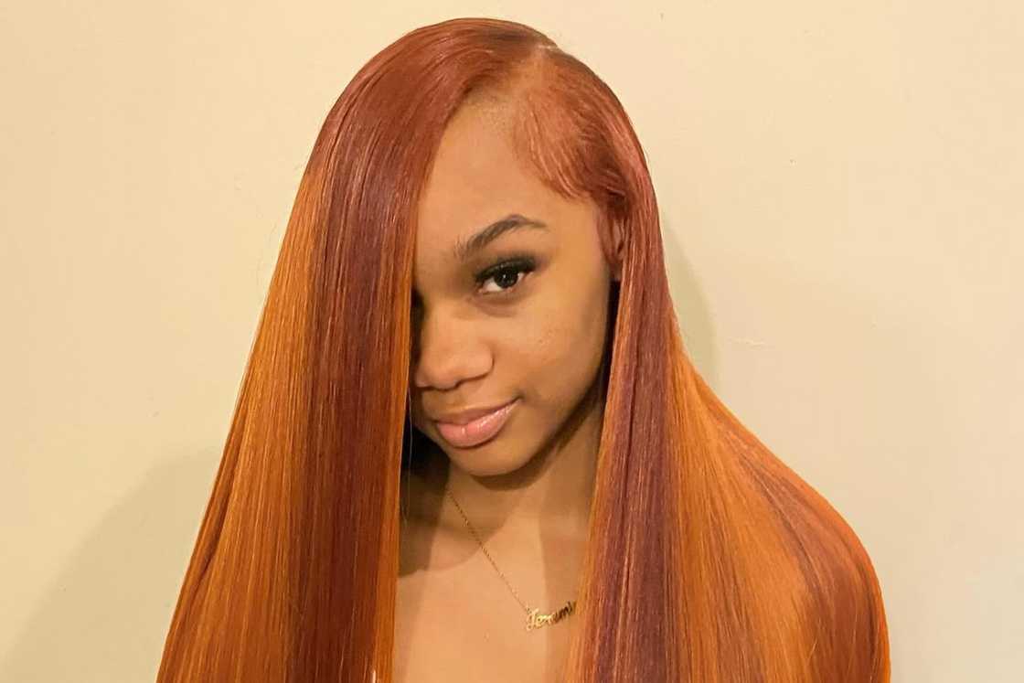 A woman is rocking a side part weave A woman is rocking a side part weave