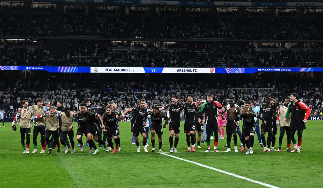 Arsenal players celebrating after knocking out Real Madrid from the UEFA Champions League with a 2-1 win at Estadio Santiago Bernabeu on April 16, 2025 in Madrid, Spain Arsenal players celebrating after knocking out Real Madrid from the UEFA Champions League with a 2-1 win at Estadio Santiago Bernabeu on April 16, 2025 in Madrid, Spain