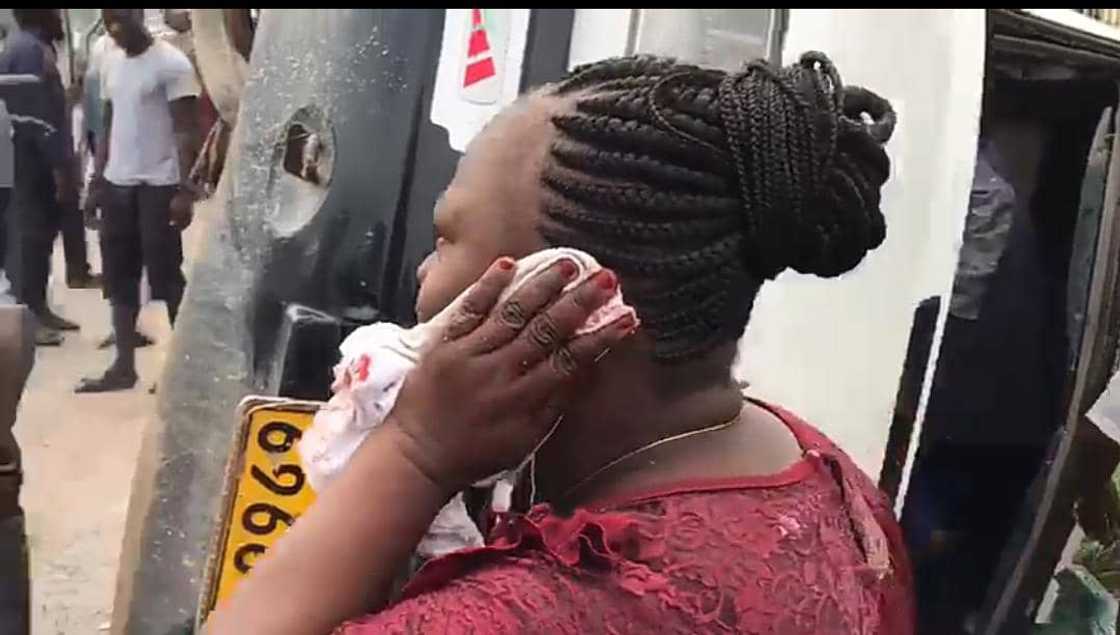 Another victim of the Kasoa-Mallam accident puts a white cloth to her ear. Another victim of the Kasoa-Mallam accident puts a white cloth to her ear.