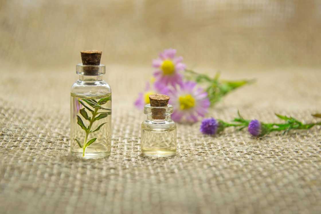 Two clear glass bottles with liquids