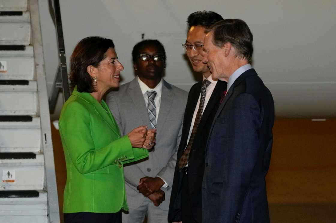 US Secretary of Commerce Gina Raimondo, (L) speaks with Lin Feng, director general of China, ministry of commerce, (2R), and US Ambassador to China Nick Burns, (R) upon arrival at the Beijing capital International Airport in Beijing, on August 27, 2023. US Secretary of Commerce Gina Raimondo, (L) speaks with Lin Feng, director general of China, ministry of commerce, (2R), and US Ambassador to China Nick Burns, (R) upon arrival at the Beijing capital International Airport in Beijing, on August 27, 2023.