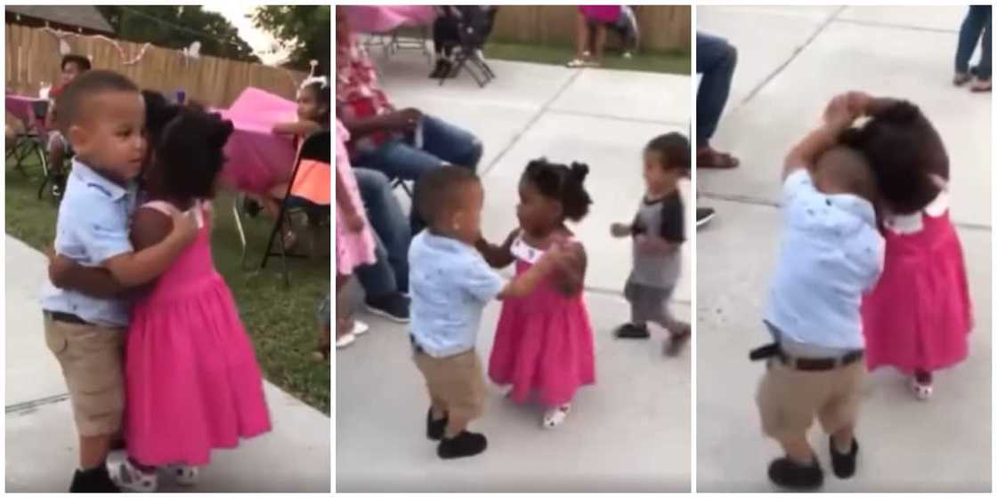 Little girl and boy serve cute couple dance as they hugged tightly and held hands in viral video Little girl and boy serve cute couple dance as they hugged tightly and held hands in viral video