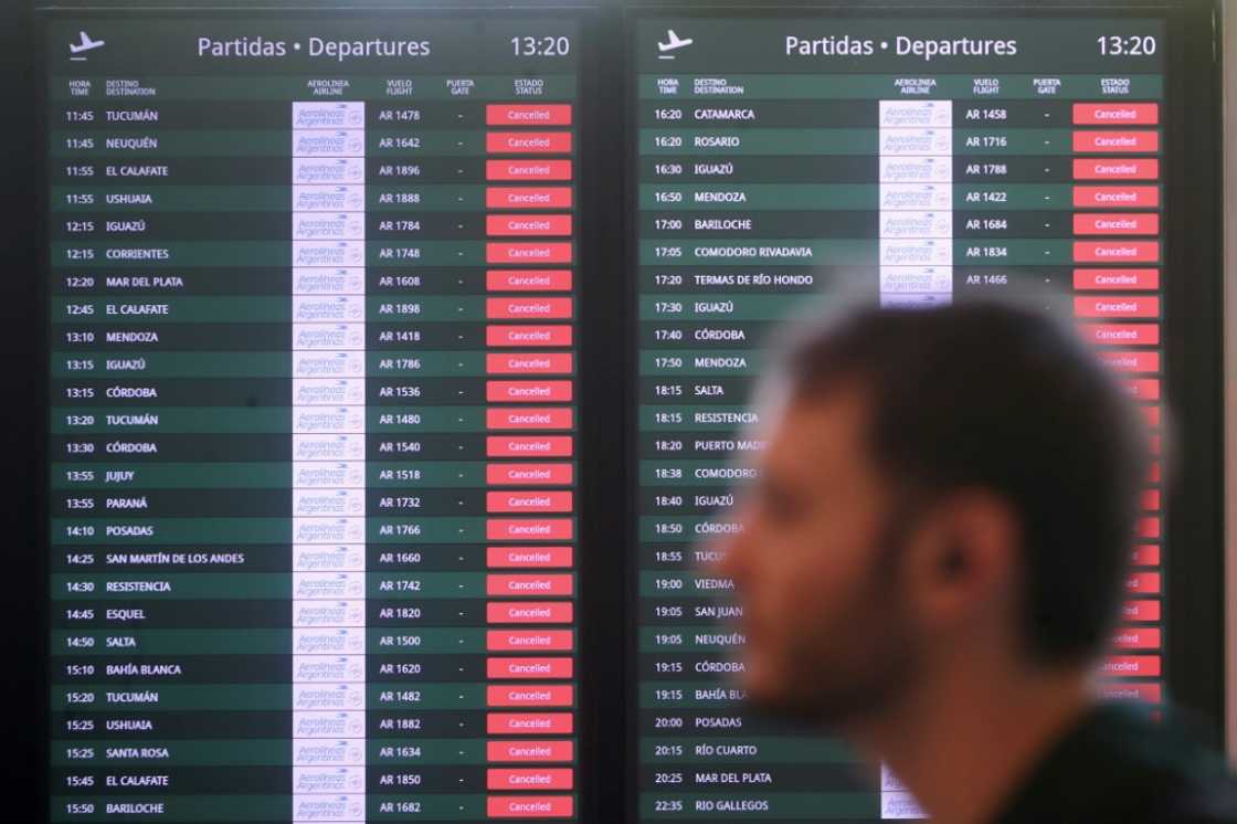 Canceled flights are highlighted in red during a massive transit strike in Argentina, aimed at protesting President Javier Milei's economic policies, at the at the Jorge Newbery Metropolitan Airport in Buenos Aires on October 30, 2024