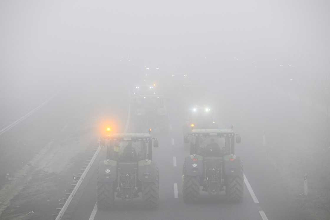 Tractors block off the A2 highway near the Spanish city of Lerida as farmers demand a better deal for their produce