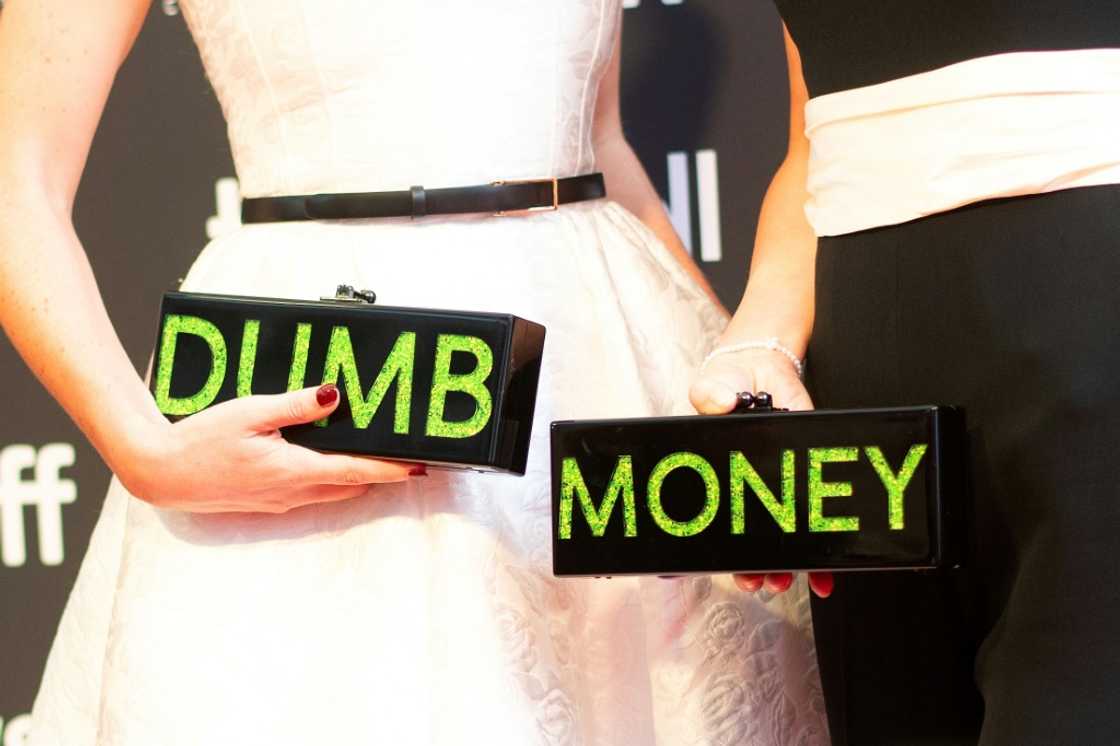 Executive producers and writers Rebecca Angelo (L) and Lauren Schuker Blum (R) repped their film 'Dumb Money' with their handbags at the Toronto premiere Executive producers and writers Rebecca Angelo (L) and Lauren Schuker Blum (R) repped their film 'Dumb Money' with their handbags at the Toronto premiere