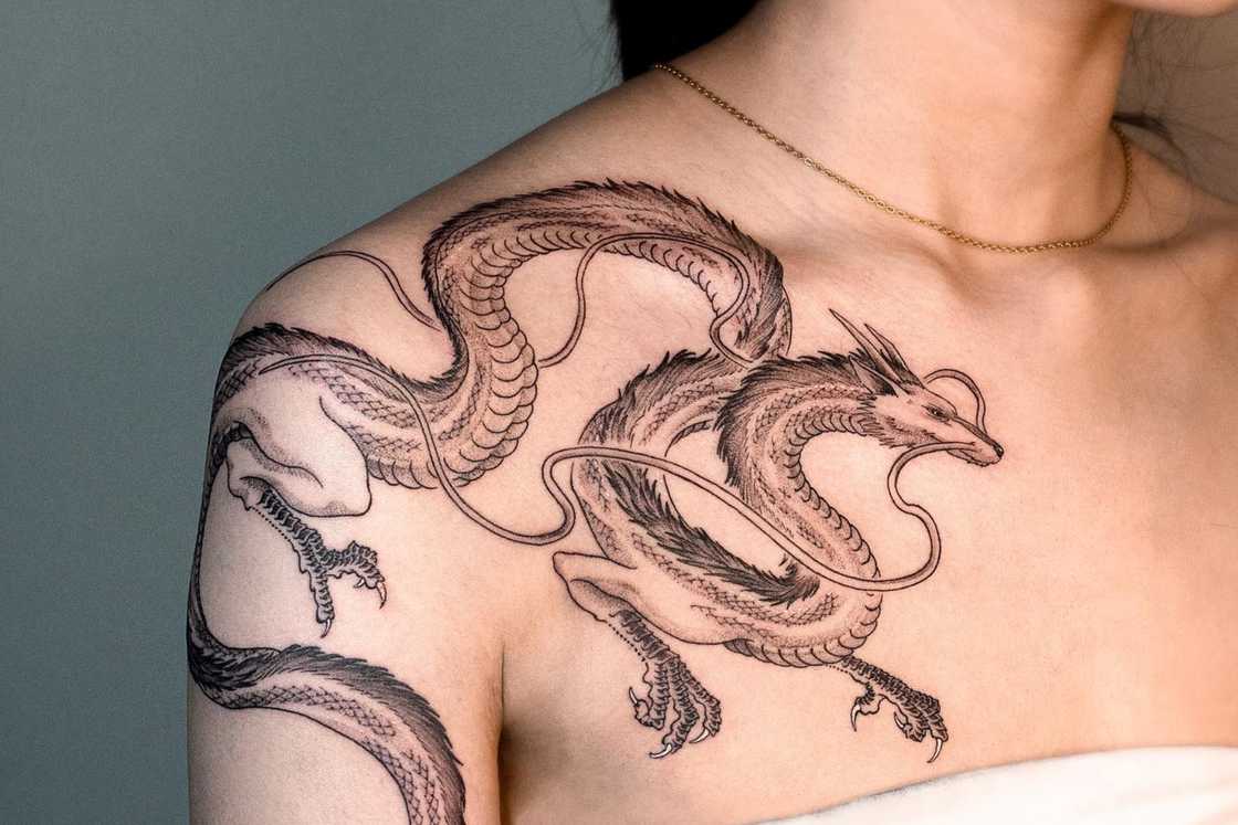 A moving dragon shoulder tattoo A moving dragon shoulder tattoo