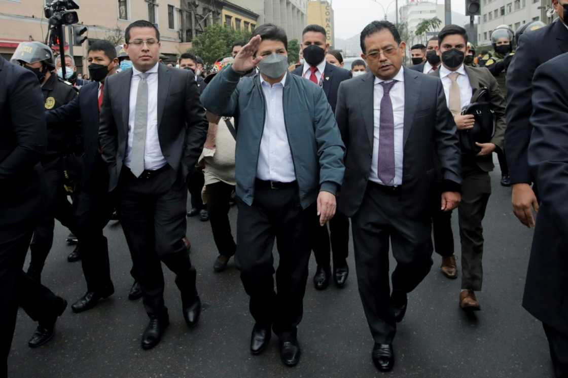 A photo distributed by the presidency of President Pedro Castillo on his way to the Attorney-General's office A photo distributed by the presidency of President Pedro Castillo on his way to the Attorney-General's office