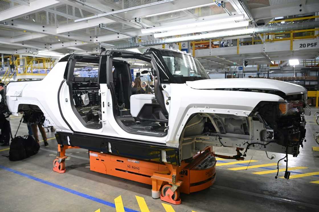A GMC Hummer EV seen on an assembly line in Michigan is part of the new electric fleet being developed by General Motors, which reported lower profits due to the semiconductor shortage A GMC Hummer EV seen on an assembly line in Michigan is part of the new electric fleet being developed by General Motors, which reported lower profits due to the semiconductor shortage