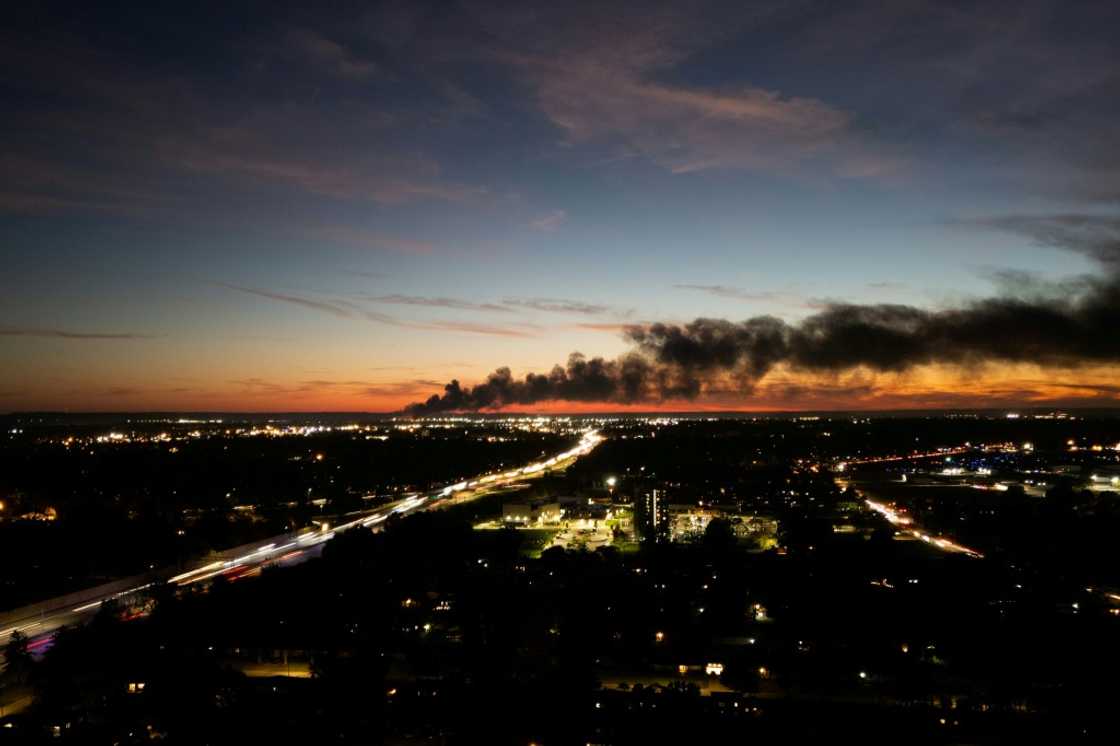 Smoke rises from the site of a UPS cargo plane crash near the UPS Worldport at Louisville Muhammad Ali International Airport in Louisville, Kentucky, on November 4, 2025