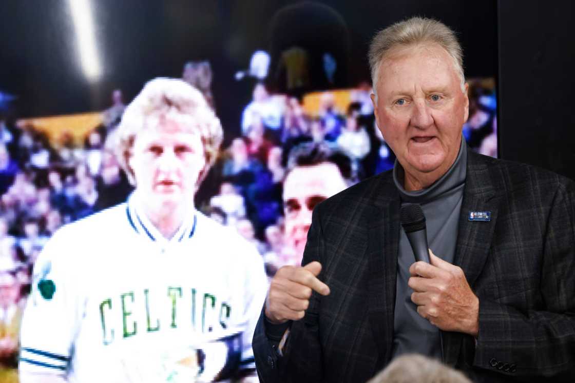 Larry Bird in a black coat