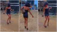 Pretty lady in tight dress struggles to walk in heels, nearly falls in video; many react