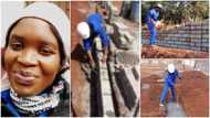 Young lady who works as bricklayer for living flaunts her work with pride in photos