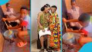 Akuapem Poloo teaches her son how to prepare banku, watches as he stirs it in video