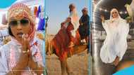 McBrown rocks Abaya in Dubai, rides camel in video "Is that Kyeiwaa behind her?"