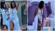 Video of woman flaunting her thighs in very high-slit dress as she struggles to cover herself goes viral; peeps react