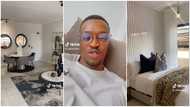 Man tours a fully furnished apartment and is impressed by its luxurious living area, bedroom, kitchen and bathroom