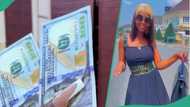 Nigerian lady receives $300 from wealthy friend in Abuja as Sallah gift, flaunts the dollar notes