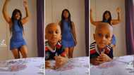 Little boy hilariously blocks curvy mom’s fire dance routine in video, leaves SA men annoyed and unimpressed