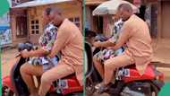 Man sleeps on shoulder of woman carrying him on motorcycle, video attracts laughter online