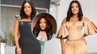 Joselyn Dumas channels Tyra Banks as she models in a stylish oversized suit and glamorous hairstyle