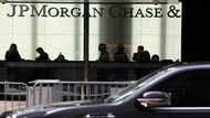 JPMorgan Chase reports lower profits, warns of economic 'headwinds'