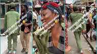 Corper in uniform visits mum's roadside shop to salute her in video, people react