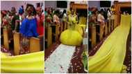 Bride confuses many as she wears weird long yellow dress for her wedding in video