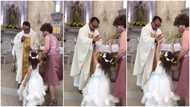 Funny moment little girl gives catholic priest high-five during prayer session