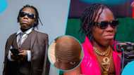 Shatta Bandle cuts off dreadlocks, flaunts bald look in a video, peeps react with funny comments