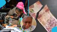 Young Ghanaian lady cries after accidentally cutting GH¢200 while sewing, video trends