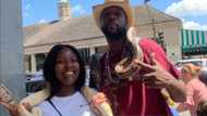 Fearless lady surprises, boldly poses with snake around her neck with tall man; photo stirs reactions