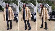 Stonebwoy looks flaming hot in a leopard print feather coat, video turns heads on social media