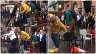 Video shows people mounting chairs to cross flooded street in London, many react