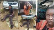 Pretty lady puts pride aside & lies on bare floor as she works as mechanic; many applaud her