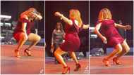 60-year-old woman in short red gown and heels dances on stage in video, makes people salivate and scream