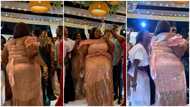 Plus-size wedding guest stuns in a corseted lace dress while jamming to Gyakie's Something song