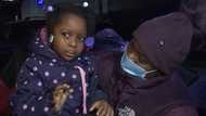 Heroic man escaping apartment fire stops to rescue young girl; mother shows appreciation