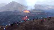 Tens of thousands trek rugged trail to glimpse Iceland volcano