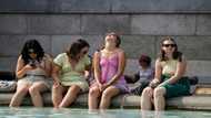 Britons desperate to cool off as mercury hits historic 40C
